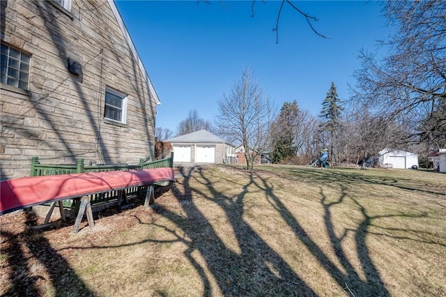 view of yard with an outbuilding and a playground