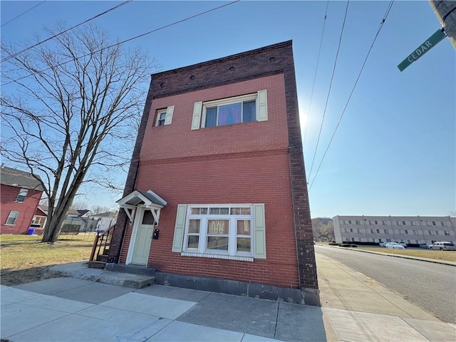 view of front of house with brick siding