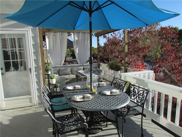 wooden deck with outdoor dining space