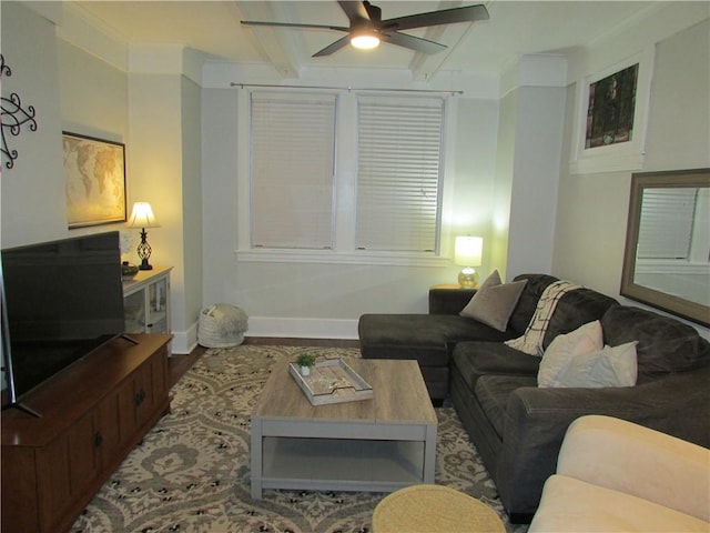 living room with wood finished floors, baseboards, beam ceiling, ceiling fan, and crown molding