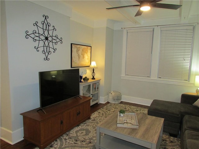 living room with beamed ceiling, baseboards, wood finished floors, and a ceiling fan