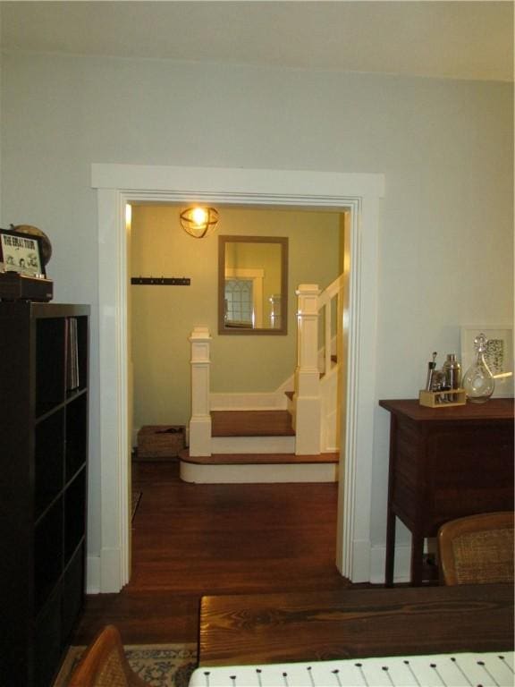 corridor with stairway and wood finished floors