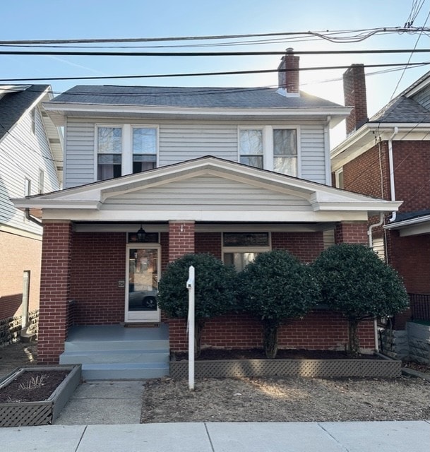 view of front of property featuring brick siding