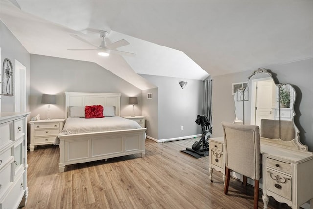 bedroom with ceiling fan, baseboards, light wood-style floors, and vaulted ceiling