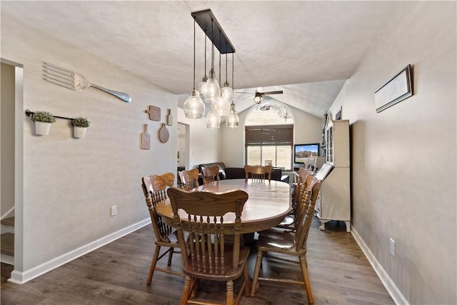 dining area featuring wood finished floors, baseboards, and ceiling fan