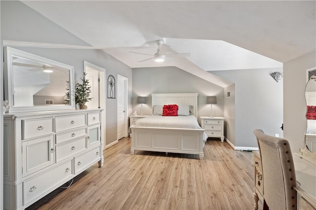 bedroom with visible vents, a ceiling fan, light wood-style floors, baseboards, and vaulted ceiling