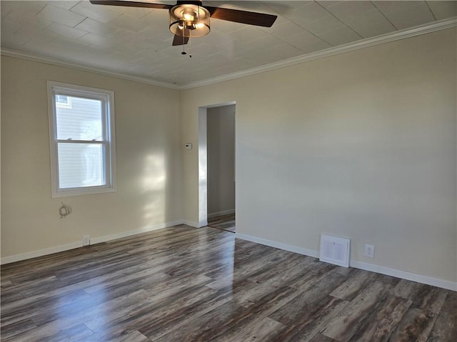 unfurnished room with visible vents, crown molding, ceiling fan, baseboards, and dark wood finished floors