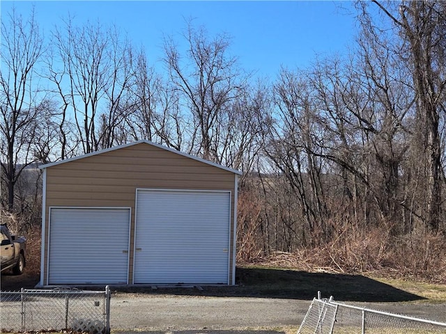 detached garage with fence