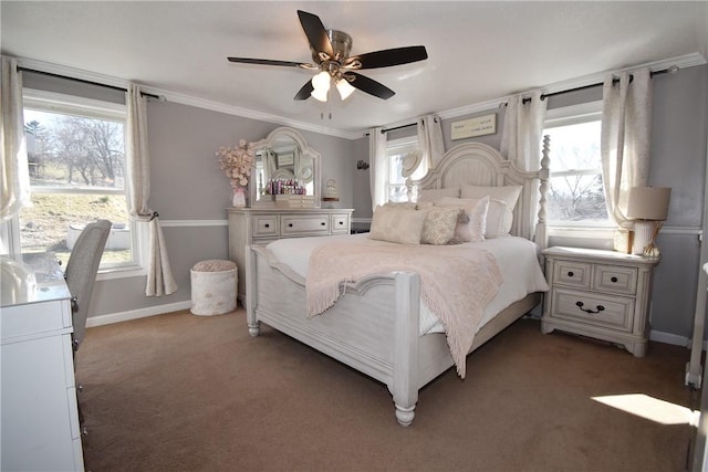 carpeted bedroom with baseboards, ornamental molding, and a ceiling fan