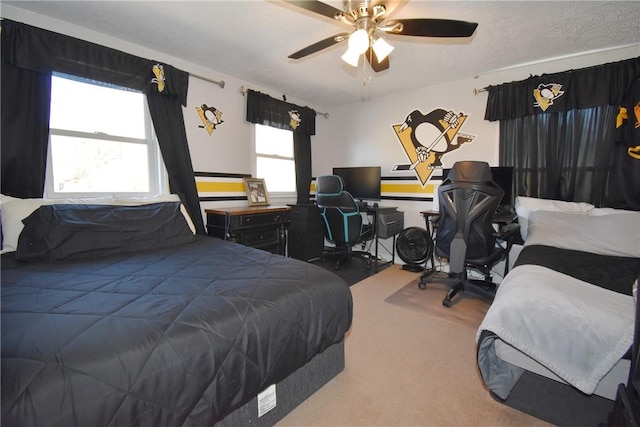 bedroom featuring ceiling fan and carpet floors