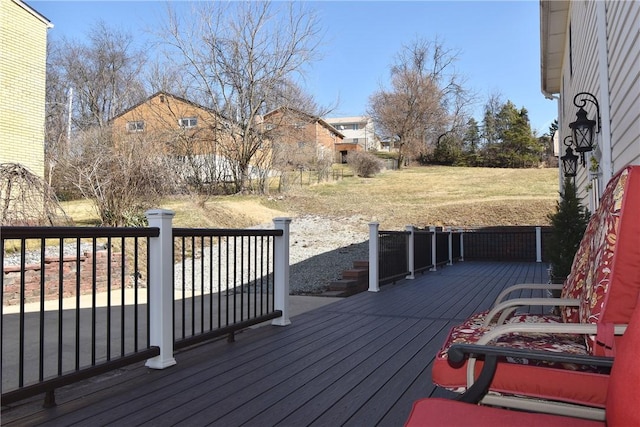 wooden deck with a residential view and a yard