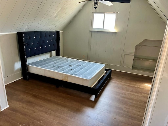 bedroom featuring ceiling fan, lofted ceiling, wood ceiling, and wood finished floors