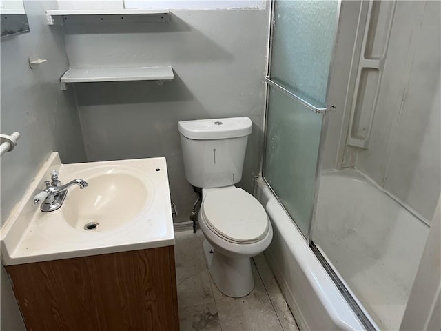 full bathroom featuring bath / shower combo with glass door, toilet, and vanity