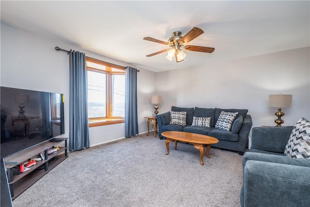 living area featuring visible vents, carpet floors, baseboards, and a ceiling fan