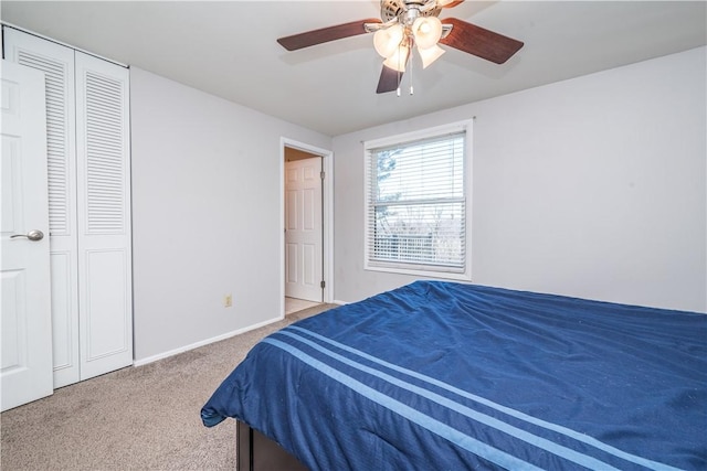 carpeted bedroom with baseboards and a ceiling fan