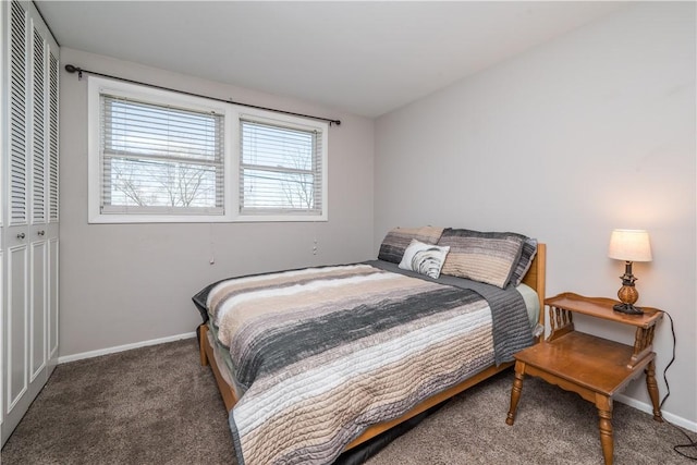 bedroom featuring carpet, a closet, and baseboards