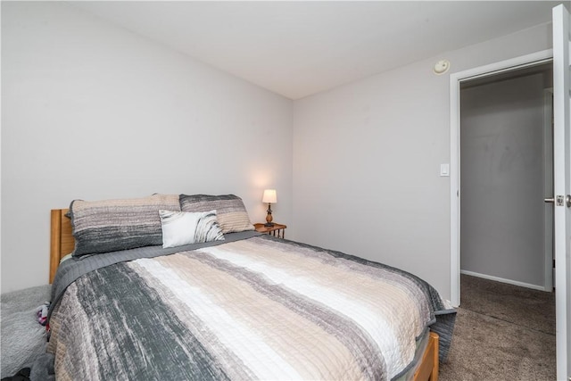 bedroom with baseboards and carpet floors