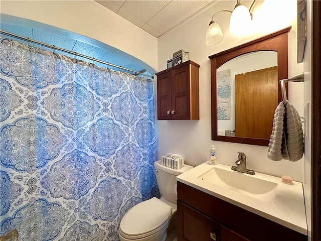 bathroom with a shower with shower curtain, toilet, and vanity