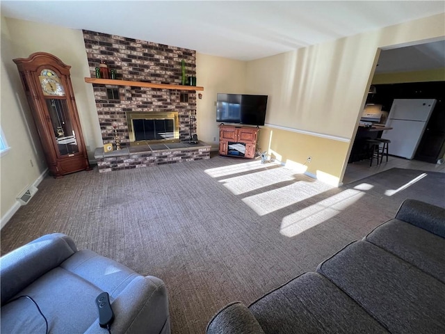 407 Cathedral St, Conemaugh/Young Twps Ind, PA 15681 - carpeted living room featuring a fireplace and baseboards