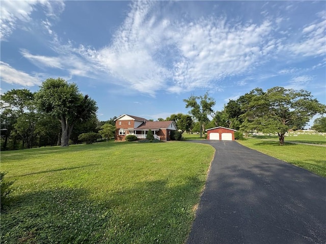 407 Cathedral St, Conemaugh/Young Twps Ind, PA 15681 - view of front of house featuring an outdoor structure, a detached garage, and a front yard