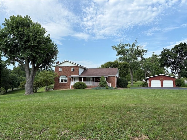 407 Cathedral St, Conemaugh/Young Twps Ind, PA 15681 - traditional home featuring brick siding, a front lawn, a detached garage, and covered porch