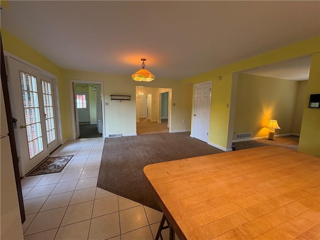 407 Cathedral St, Conemaugh/Young Twps Ind, PA 15681 - unfurnished dining area with light tile patterned flooring and light carpet