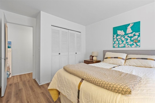 8179 Ohio River Blvd Unit 32, Emsworth, PA 15202 - bedroom featuring a closet, baseboards, and wood finished floors