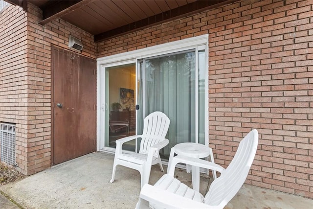 8179 Ohio River Blvd Unit 32, Emsworth, PA 15202 - view of exterior entry with brick siding and a patio area