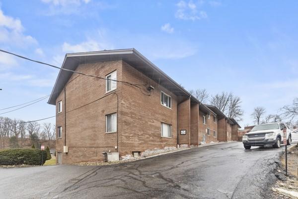 8179 Ohio River Blvd Unit 32, Emsworth, PA 15202 - view of property exterior with brick siding and cooling unit