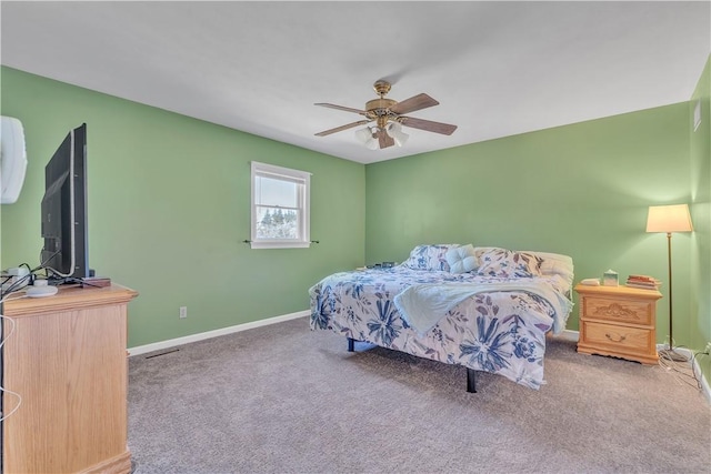 carpeted bedroom featuring visible vents, baseboards, and ceiling fan