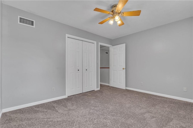 unfurnished bedroom with visible vents, baseboards, and carpet