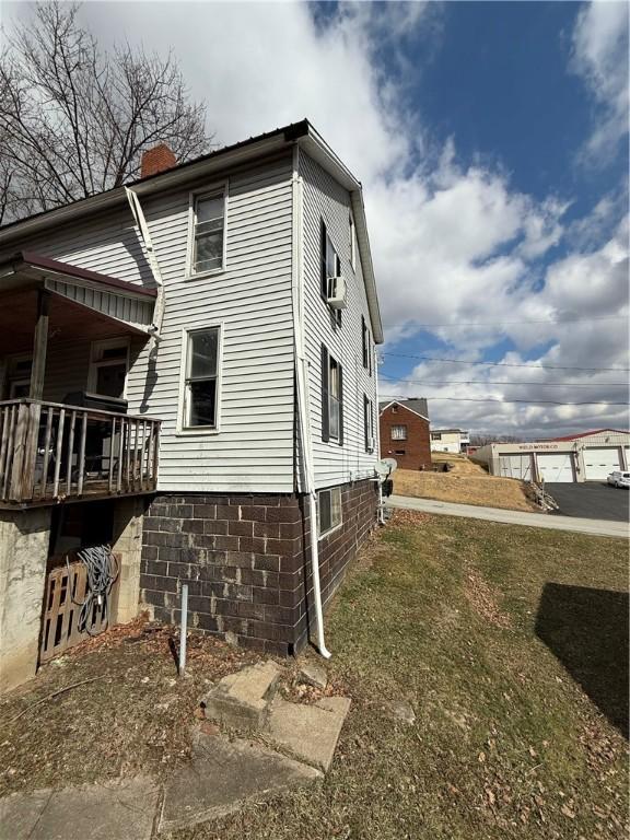 view of side of home with a chimney