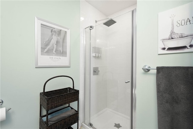 full bath featuring a shower stall