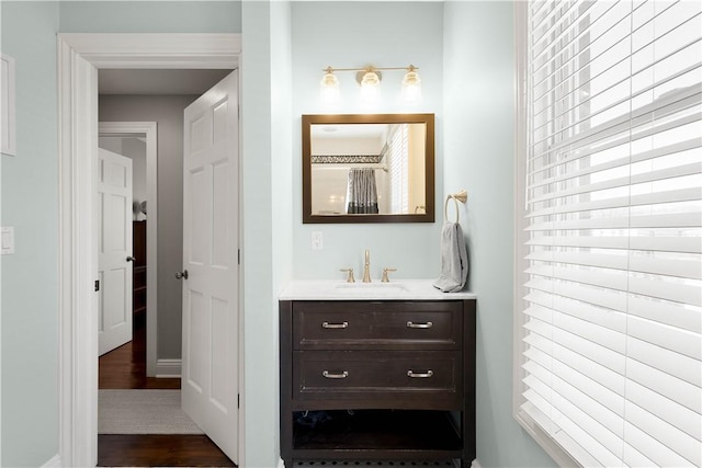 bathroom featuring vanity and wood finished floors