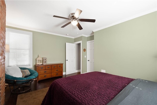 bedroom featuring dark wood finished floors, a ceiling fan, and ornamental molding