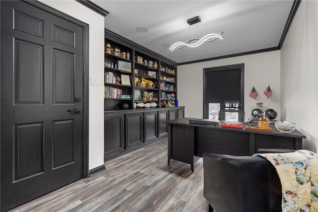 home office featuring light wood-style flooring and ornamental molding