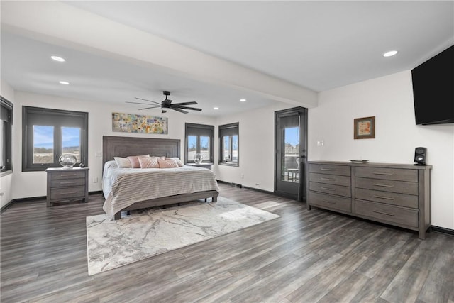 bedroom with recessed lighting, dark wood finished floors, and access to outside