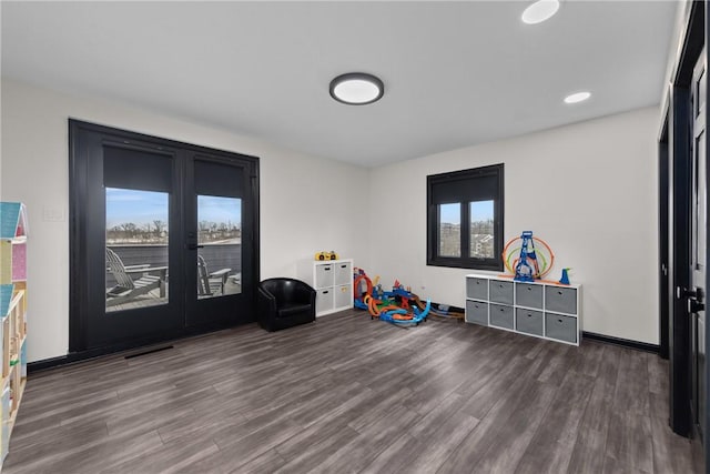 game room featuring visible vents, wood finished floors, recessed lighting, french doors, and baseboards