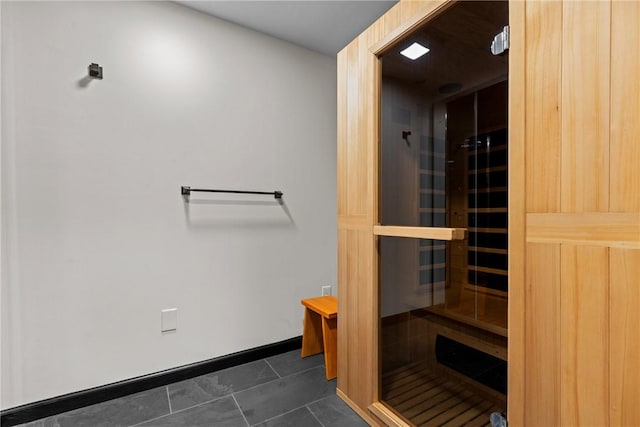 view of sauna featuring tile patterned floors and baseboards