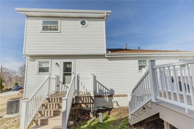 rear view of house with central AC