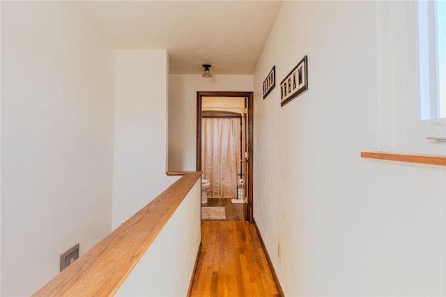 hallway with light wood-style floors