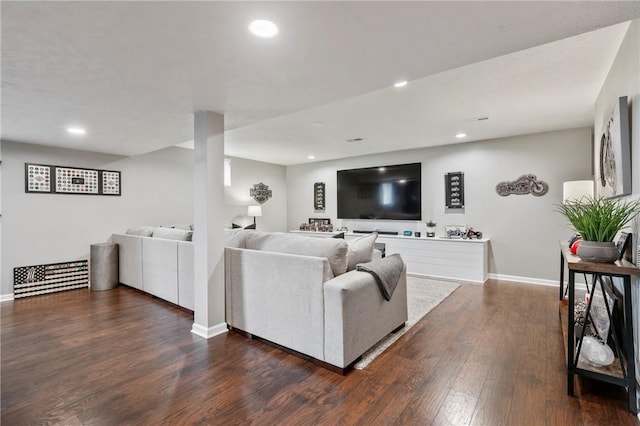 living area featuring recessed lighting, baseboards, and dark wood-style floors