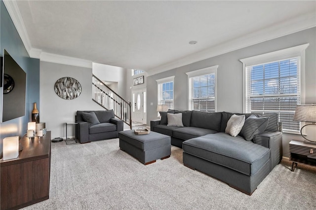 carpeted living area with crown molding and stairway