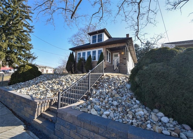 view of front of property with a chimney