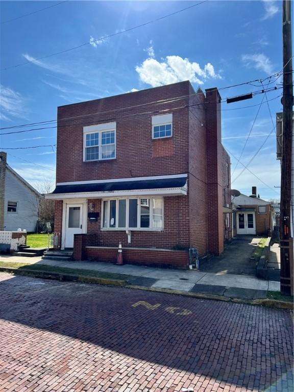 view of front of property with brick siding