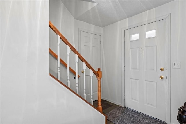 foyer featuring stairs