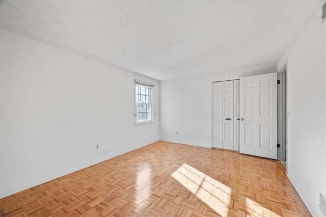 unfurnished bedroom with a closet