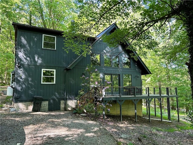 240 Birch Rd, Bullskin Twp, PA 15610 - rear view of property featuring a deck and board and batten siding