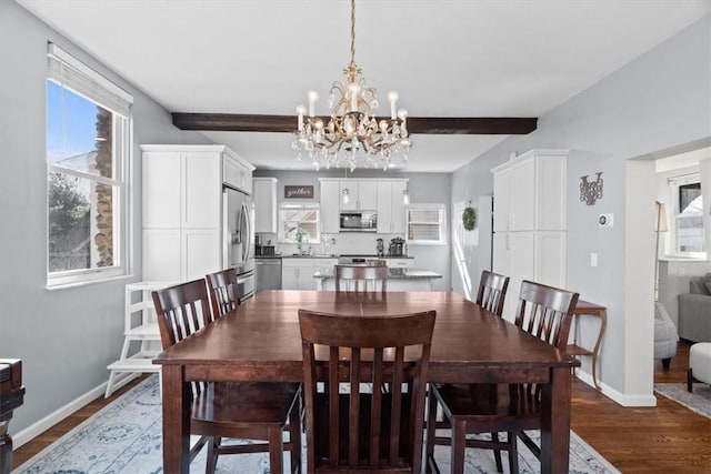 dining space featuring beamed ceiling, baseboards, dark wood finished floors, and a chandelier