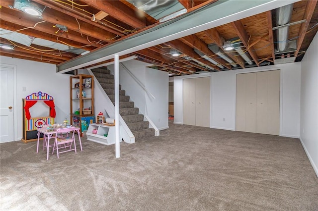unfinished below grade area featuring stairway and carpet floors